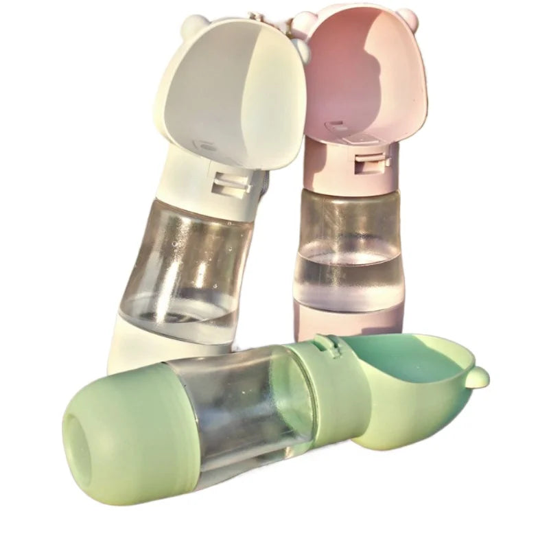 Three transparent water bottles with colorful lids Travel pet water dispenser for dogs and cats