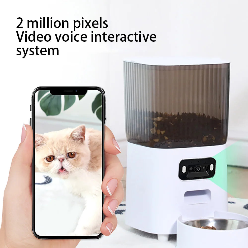 Pet feeder with smartphone displaying a cat's face, labeled '2 million pixels Video voice interactive system'. - 5L dual bowl smart automatic pet with HD Camera.