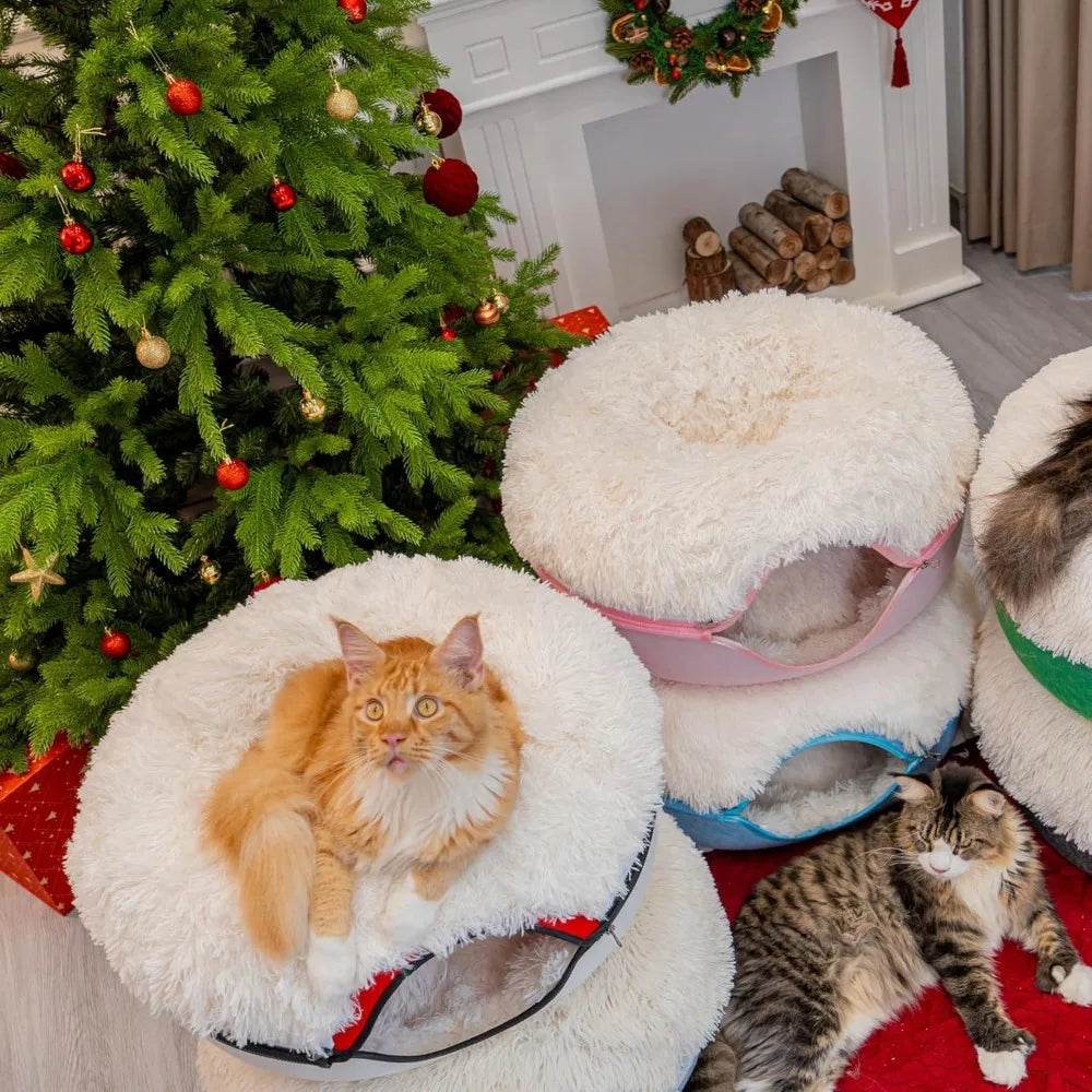 Two cats in fluffy cat beds with a decorated Christmas tree and fireplace soft cat house with scratching pad for indoor cats.