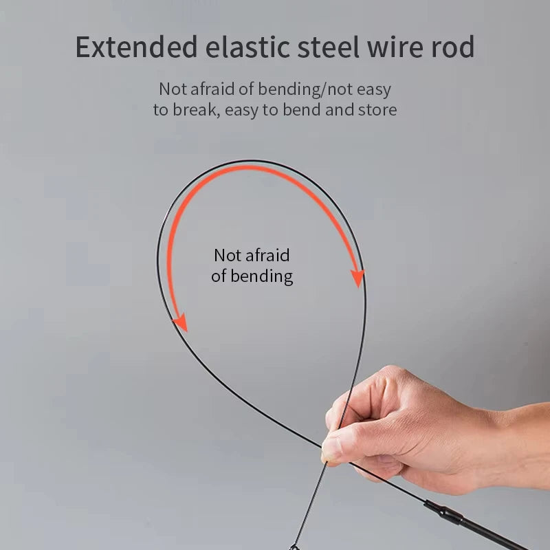 Extended elastic steel wire rod being bent by a hand on a gray background
