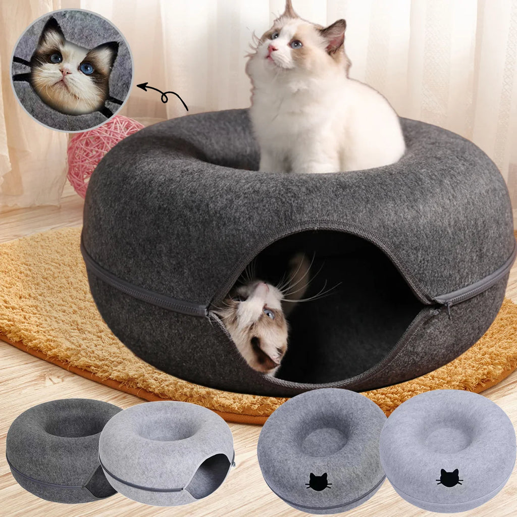 Cat bed with two cats inside, one peeking out, on a wooden floor 2-in-1 felt cat cave bed with interactive tunnel for indoor cats and small dogs.