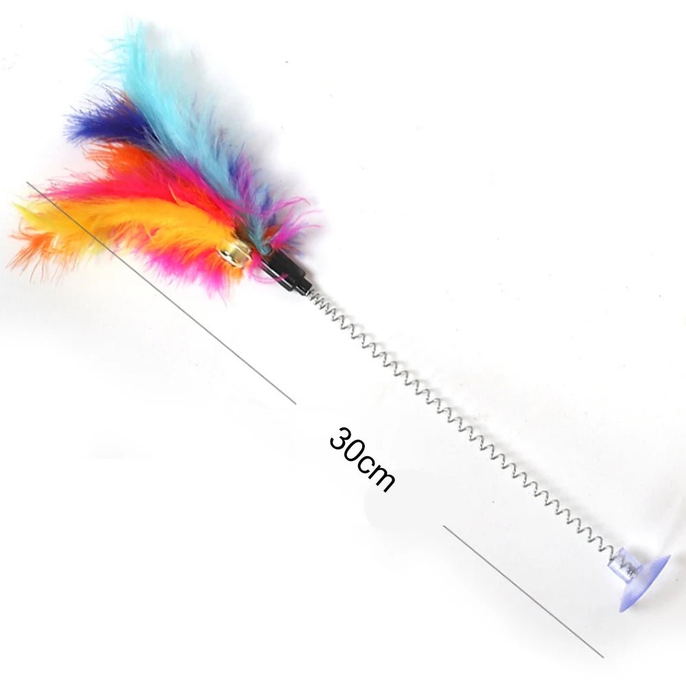 Colorful feather cat toy with a measurement label. Multi-level wooden ball track toy for indoor cats.