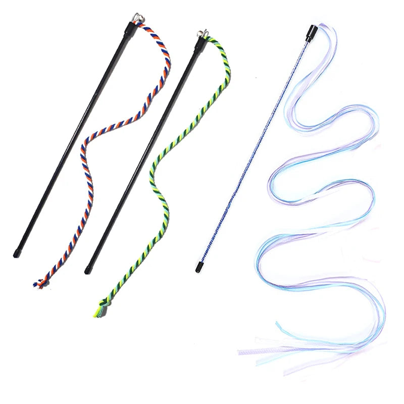 Three colorful whips with ribbons on a white background. Indoor cat playing with interactive rope wand toy.